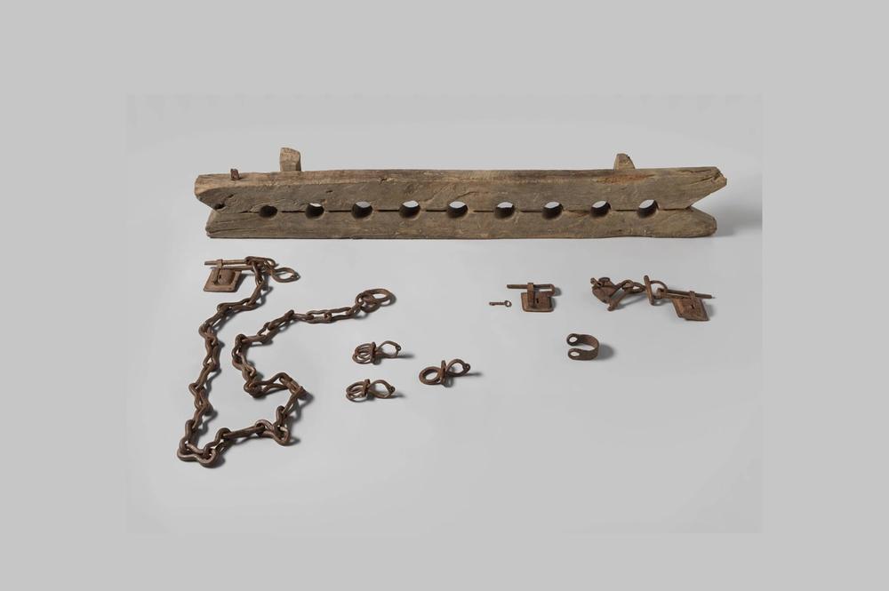 wooden ankle shackle with metal chains
