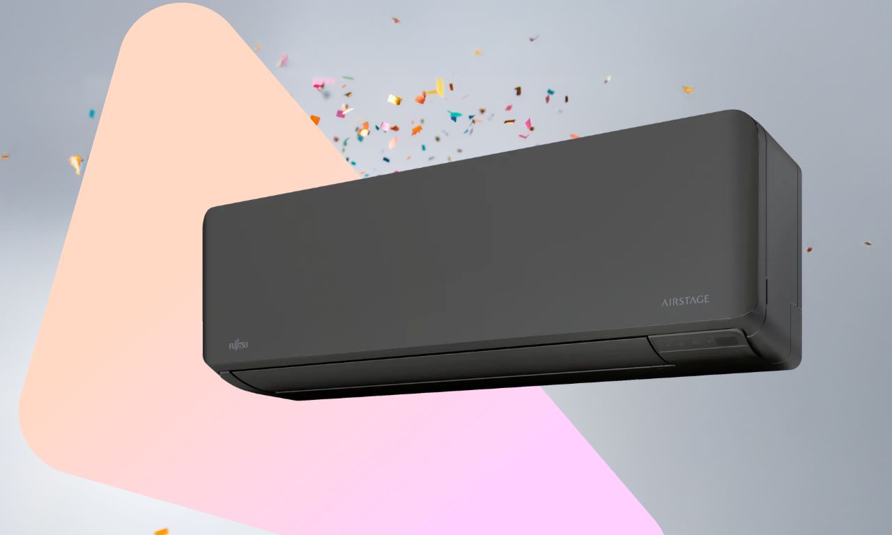 Produktbilde av varmepumpen Fujitsu Norgespumpa i sort som er premie i oktober-konkurransen oppå bakgrunn med konfetti.