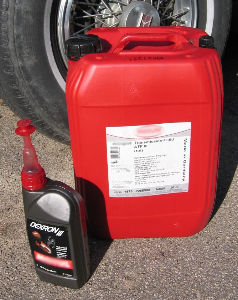 A red fire extinguisher Description automatically generated with medium confidence