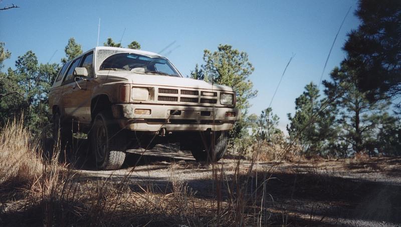 brown stripe toyota 4runner on the road