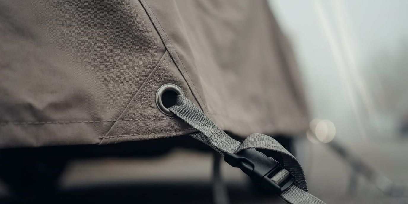Grommet + tie-down strap