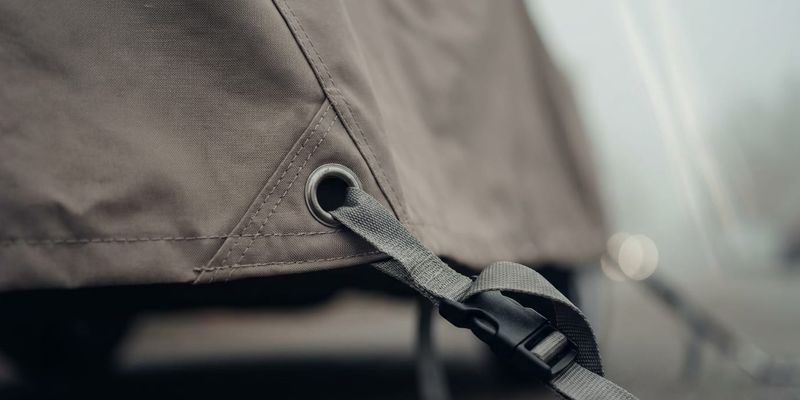 Grommet + tie-down strap