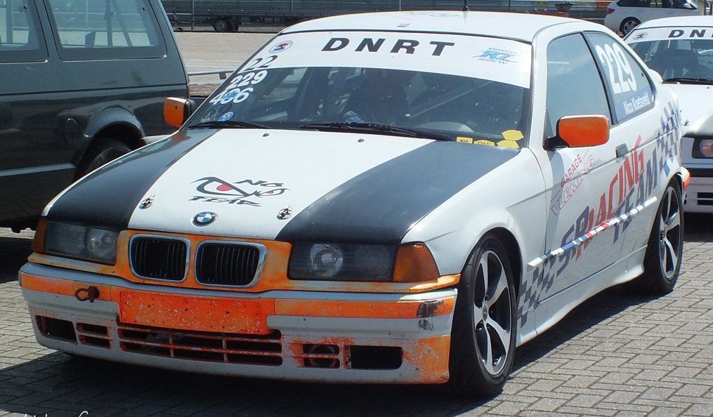 A picture containing text, car, outdoor, transport Description automatically generated
