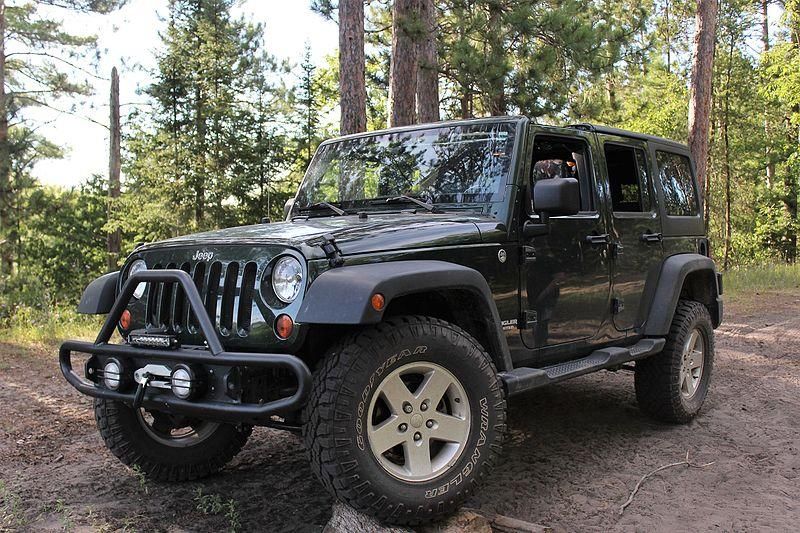 jeep wrangler off-road in forest