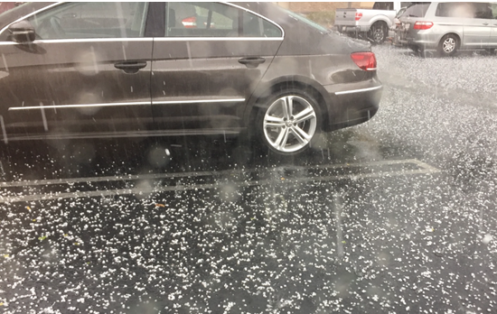 hail storm on car parking lot