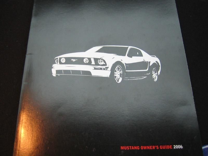 A white car on a black background Description automatically generated with low confidence