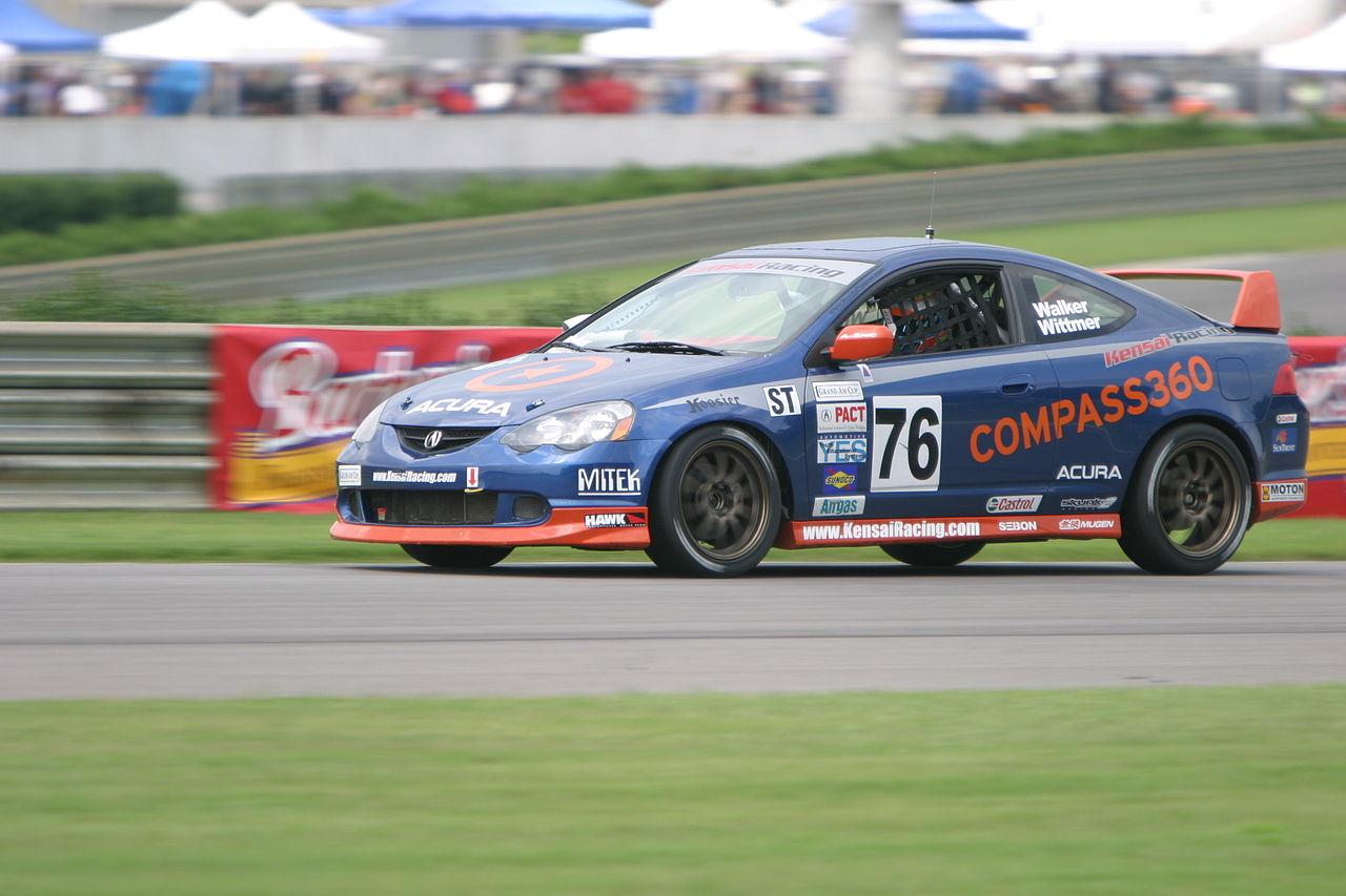 A race car on a track Description automatically generated