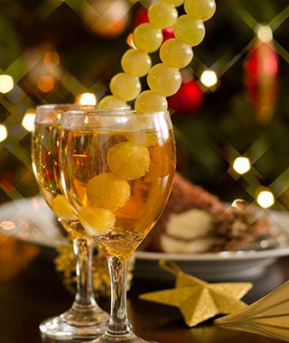Happy New Year - champagne, grapes and party decoration