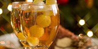 Happy New Year - champagne, grapes and party decoration