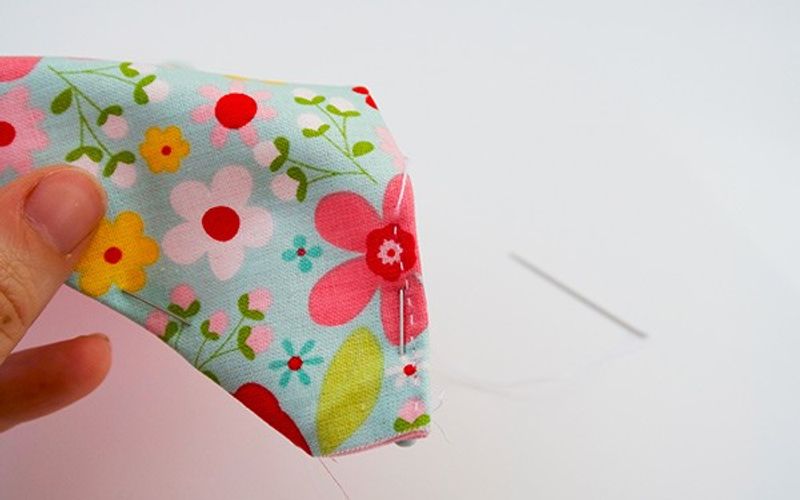 Hand sewing the dog bandana