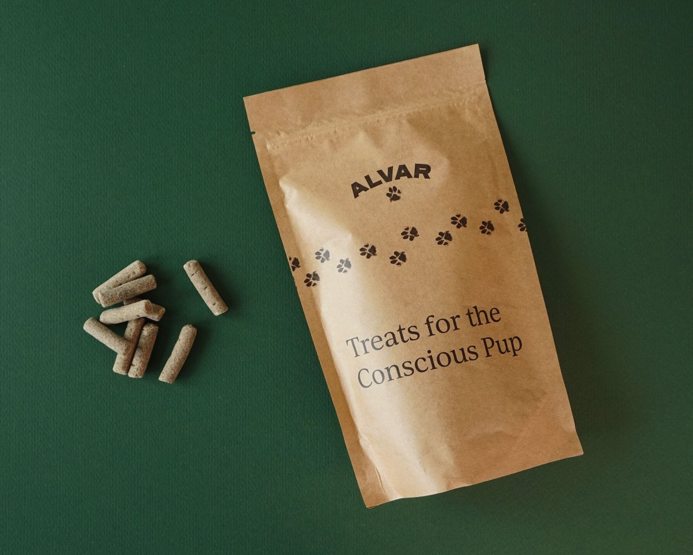 Package of Alvar pet snacks next to a small pile of the snacks