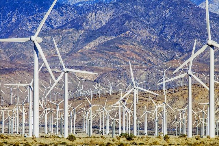 States and Counties With the Highest Rates of Lung Cancer - Infographics of a large wind farm in a desert region, symbolizing clean energy efforts in states with lower per capita carbon emissions like California.