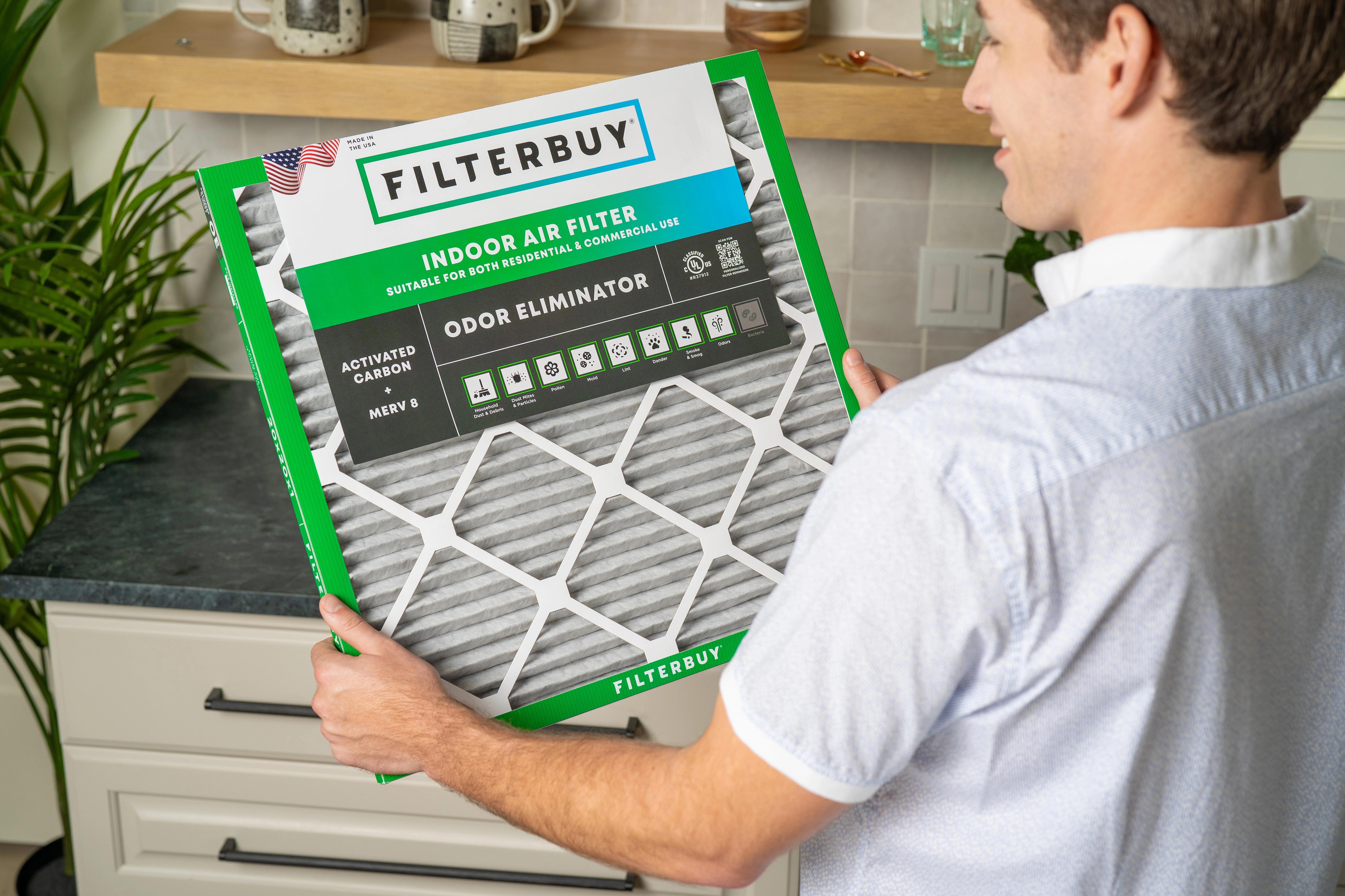 Image of a Filterbuy Carbon Air Filter being held by a homeowner after recently purchasing it via Filterbuy website.