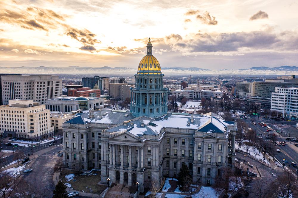 Image of snowcapped roofs of a historic landmark in Colorado.