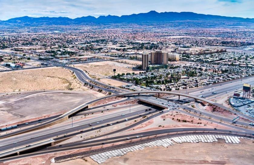 Cities With the Oldest Populations - Infographics of A cityscape with highways through the desert, likely home to an older population with easy access to natural beauty.
