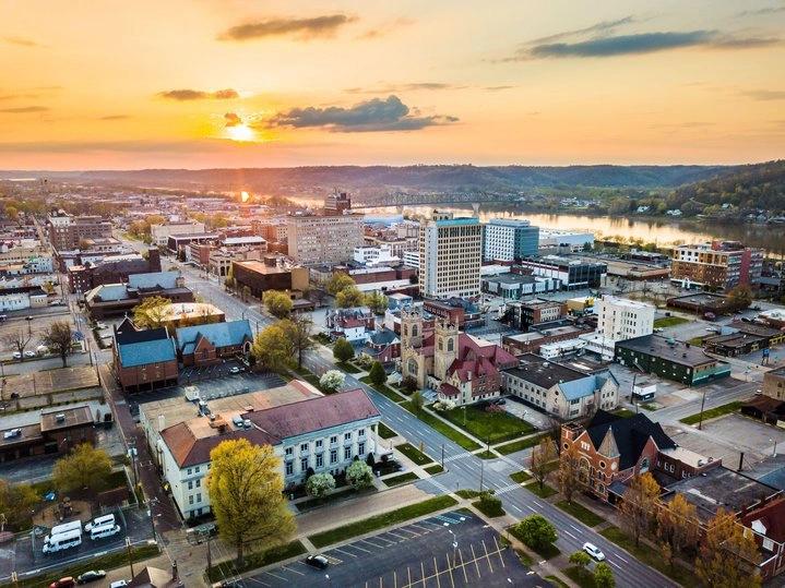 The Hottest City in Every State - Infographics of Huntington the hottest city in West Virginia, glowing at sunset.