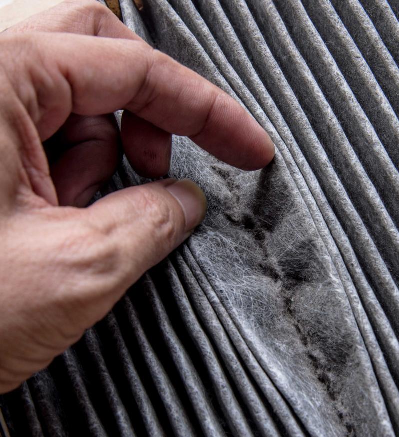 Image of an HVAC filter that is filled with dust.