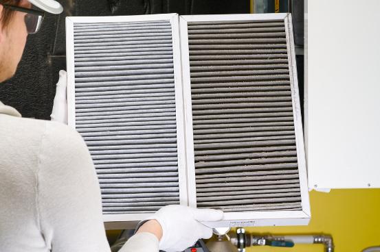 A view of an air filter being installed inside a home.