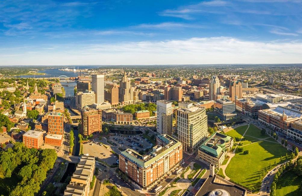 States and Counties With the Highest Rates of Lung Cancer - Infographics of a Connecticut State Capitol in fall, symbolizing New England states' strong environmental policies and relatively low carbon emissions per capita.