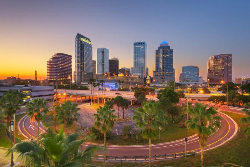 States With Fastest Growing Economies - Image of the beautiful Florida downtown city skyline over roads and highways.