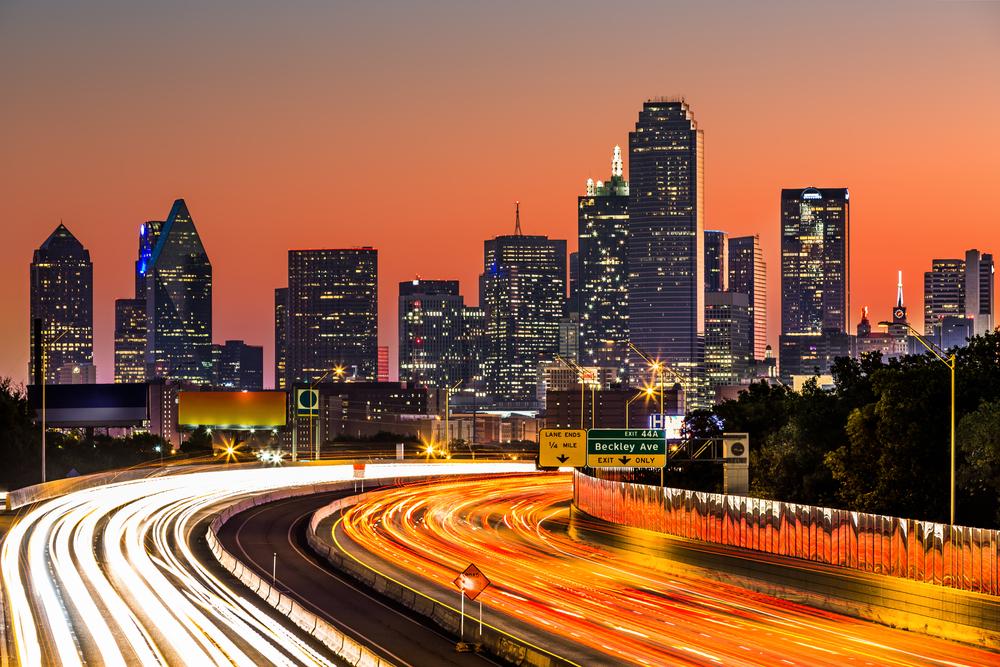 Image of a busy Dallas highway just after sunset.
