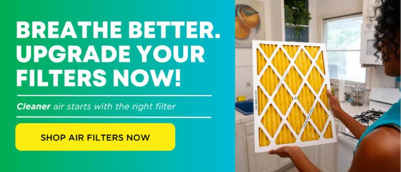Image of a woman holding a new, clean HVAC air filter from Filterbuy.