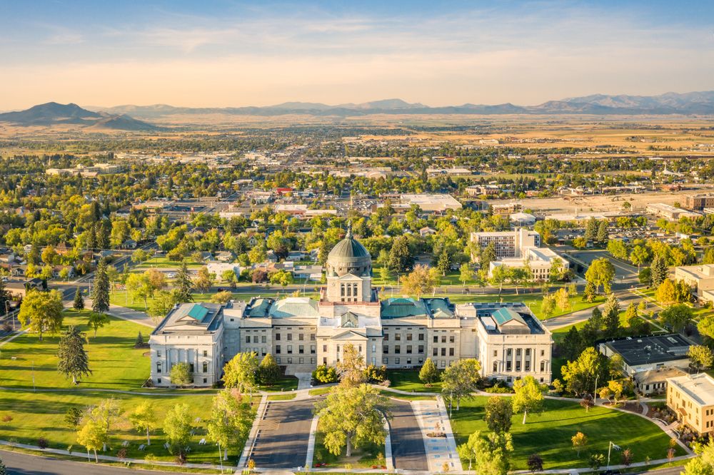 Aerial view of the Montana State Capitol, with scenic views of the city, reflecting the state's role in the veteran population.