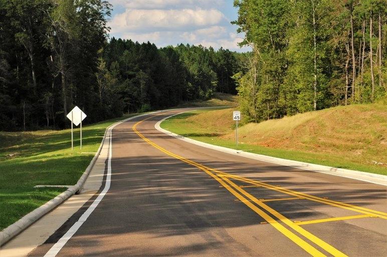 The Hottest City in Every State - Infographics of a Rural highway near a Southern city known for long, hot, and humid summers.