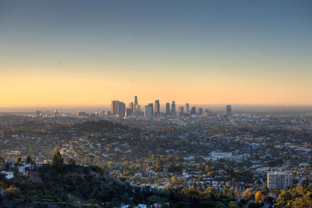 U.S. Cities with Worst and Best Air Quality - Infographics of a towering skyscrapers and surrounding hills, a place where poor air quality has historically been a significant challenge