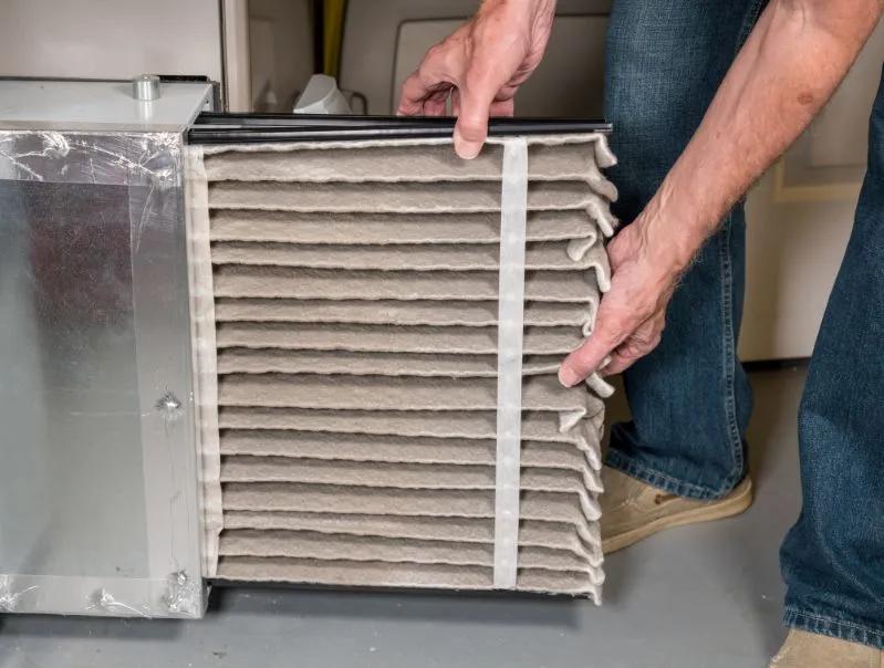 Close-up view of an air filter with good cfm airflow that fits perfecly inside an air vent.