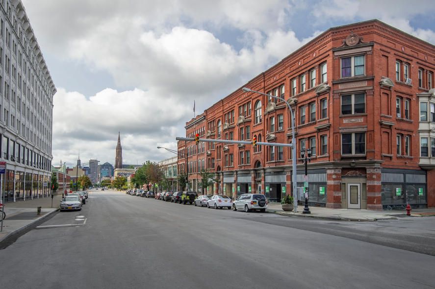 States and Counties With the Highest Rates of Lung Cancer - Infographics of a historic downtown street in a northeastern U.S. city, reflecting older urban areas that may face elevated lung cancer rates due to long-term exposure to pollutants.