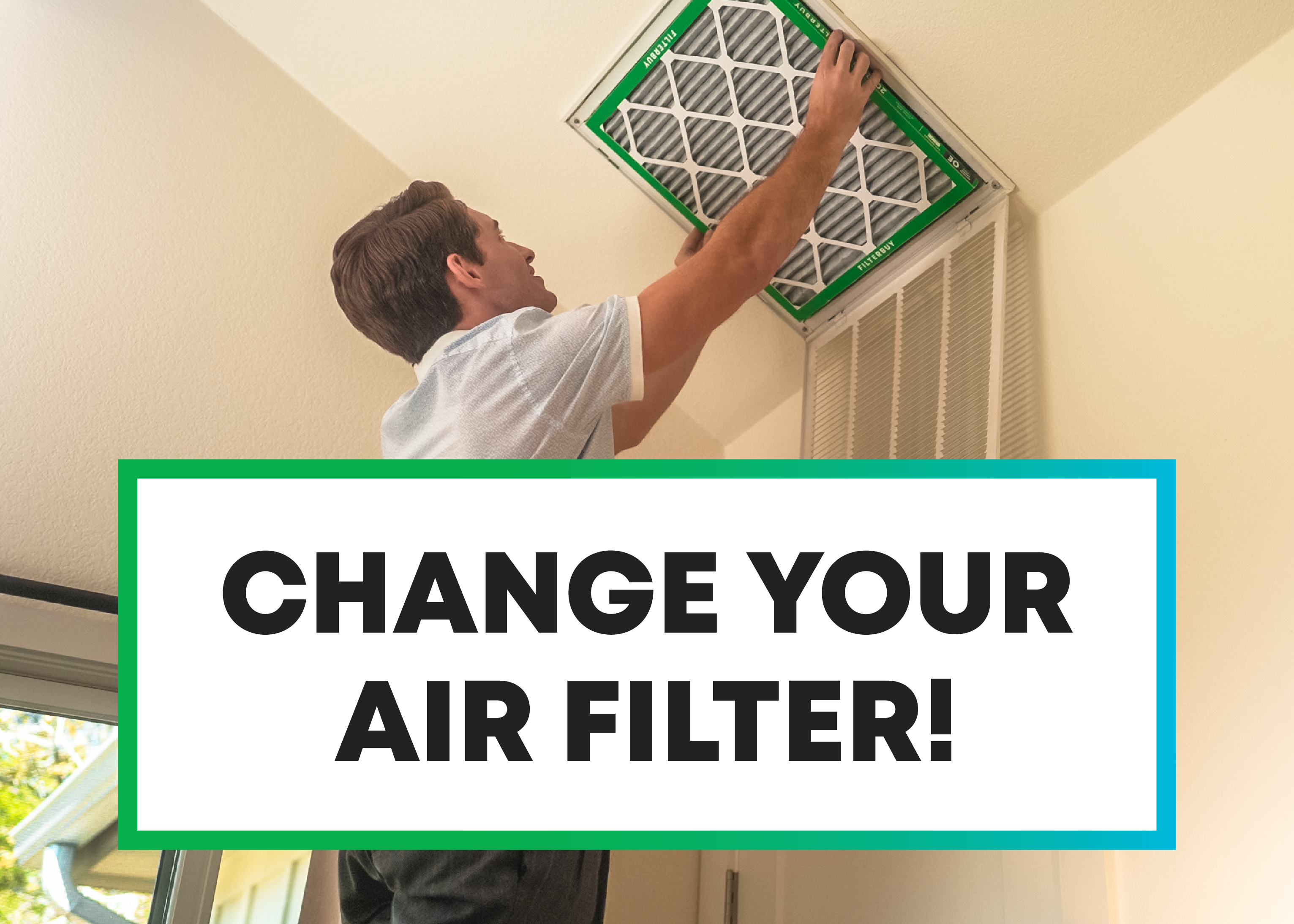 Man replacing a home air filter from a ceiling vent with a green Filterbuy filter.