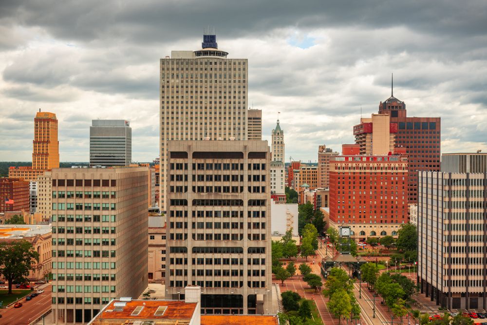 Memphis downtown skyline under cloudy skies with a mix of modern and historic buildings.