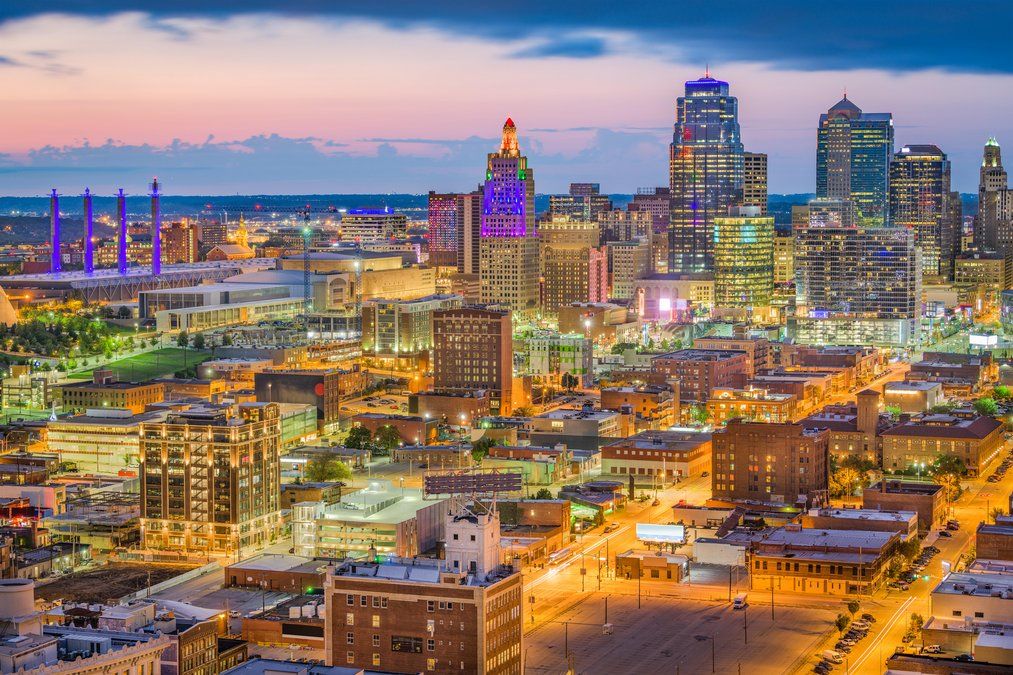 Colorful cityscape with vibrant lighting at sunset