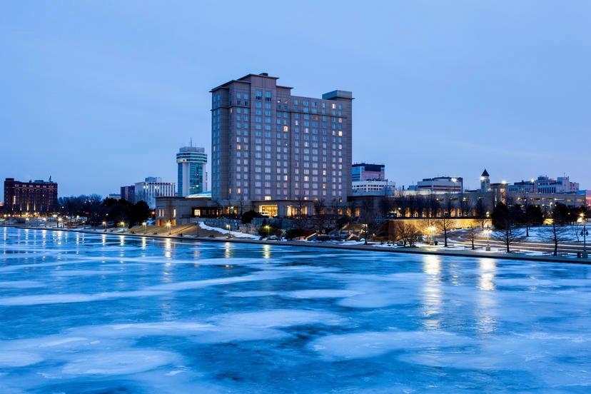 Cities With the Oldest Populations - Infographics of a hotel beside a frozen lake, a perfect environment for retirees in one of the cities with the oldest populations.