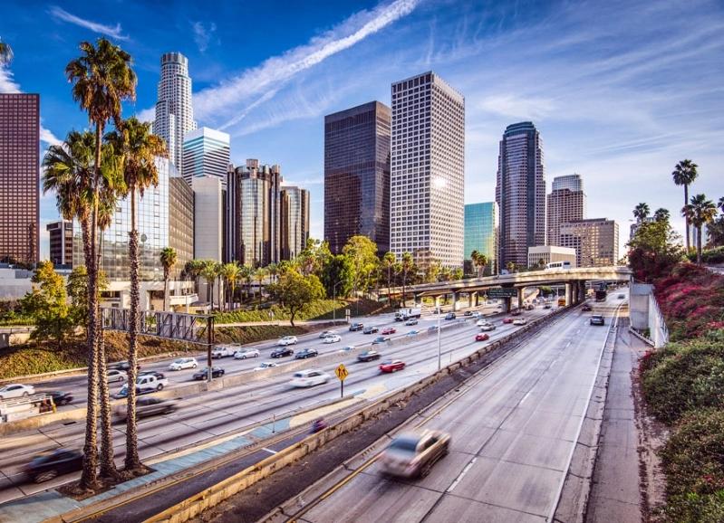 Cities Where Remote Workers Log the Most Hours - Images of the Los Angeles cityscape with palm trees and busy highways, featuring the downtown skyline with skyscrapers against a blue sky.