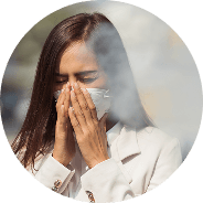 Person rubbing eyes from irritation