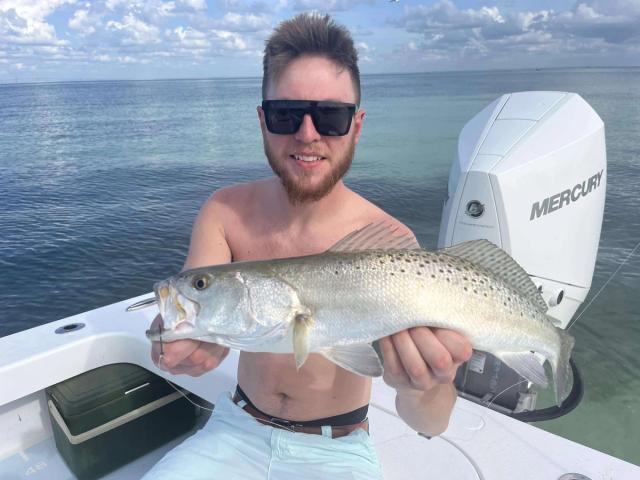 Captain David White Fishing Charters client with their catch
