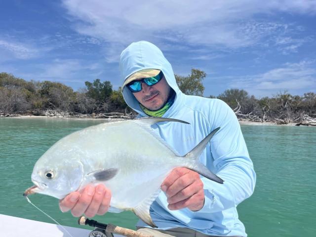 Captain David White Fishing Charters client with their catch