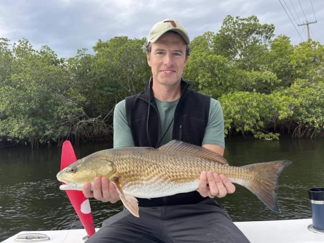 Captain David White Fishing Charters client with their catch