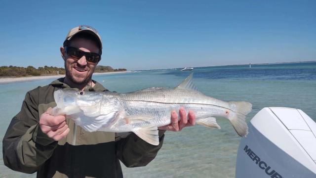 Captain David White Fishing Charters client with their catch