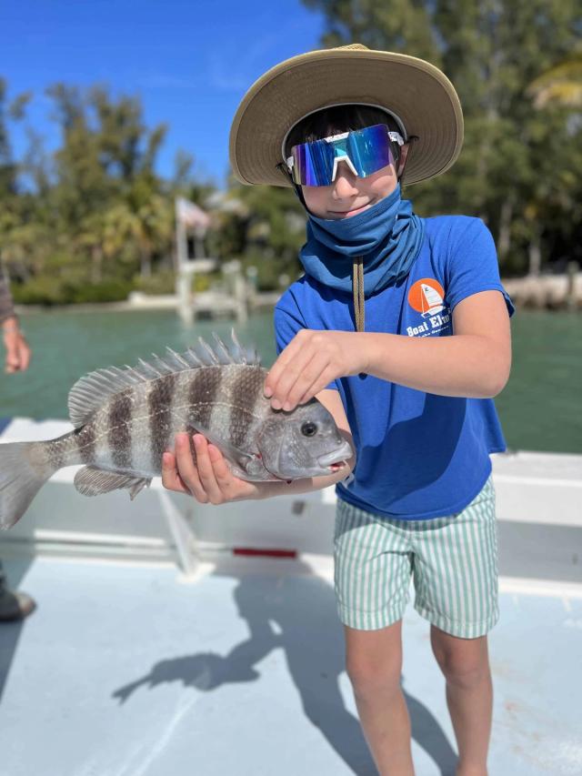 Captain David White Fishing Charters client with their catch