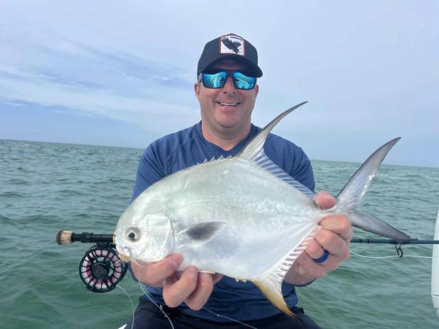 Captain David White Fishing Charters client with their catch