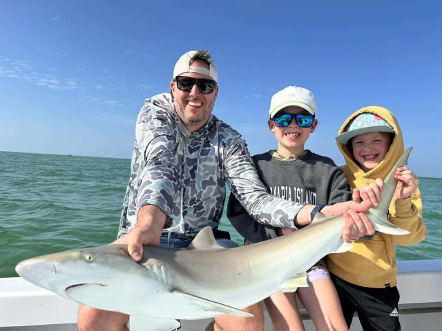 Captain David White Fishing Charters client with their catch