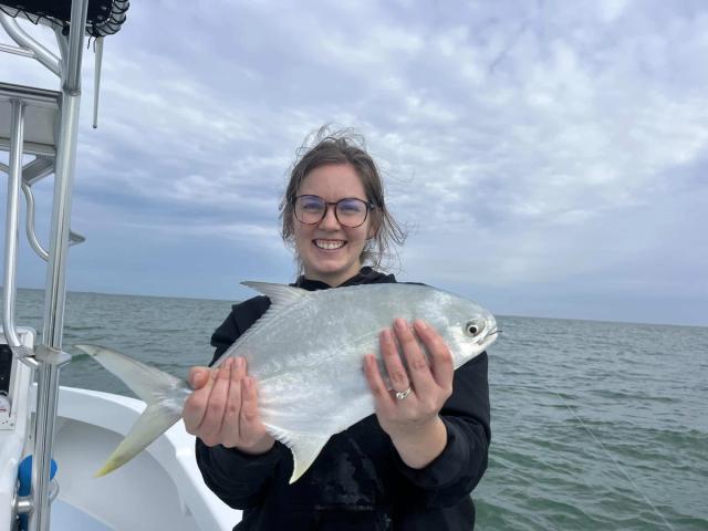 Captain David White Fishing Charters client with their catch