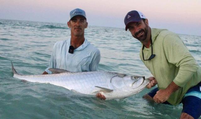 Captain David White Fishing Charters client with their catch