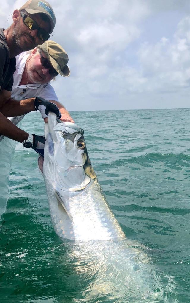 Captain David White Fishing Charters client with their catch