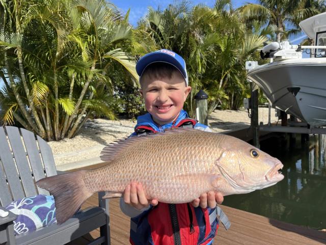 Captain David White Fishing Charters client with their catch