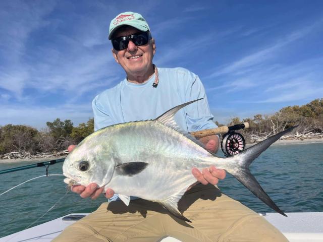 Captain David White Fishing Charters client with their catch