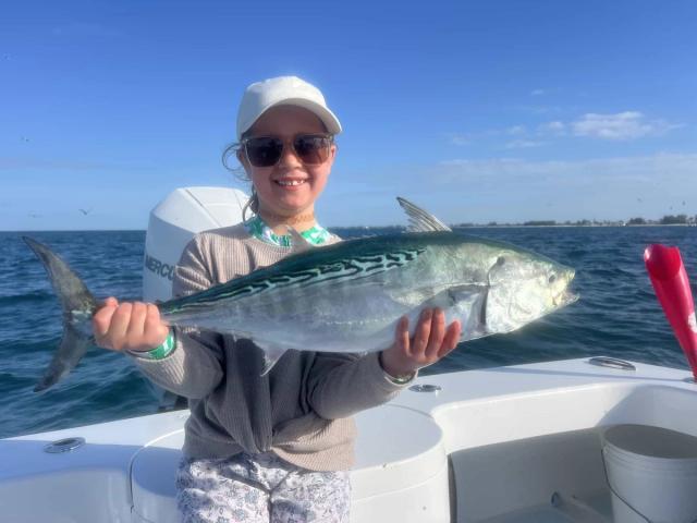 Captain David White Fishing Charters client with their catch